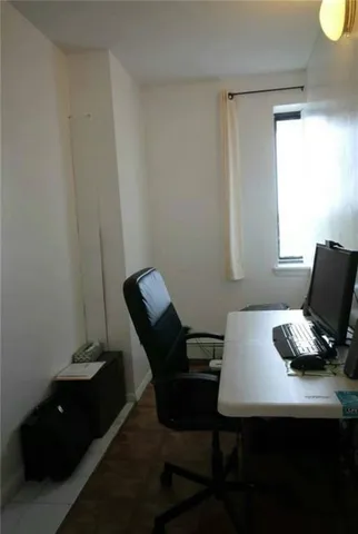 a view of a workspace with furniture
