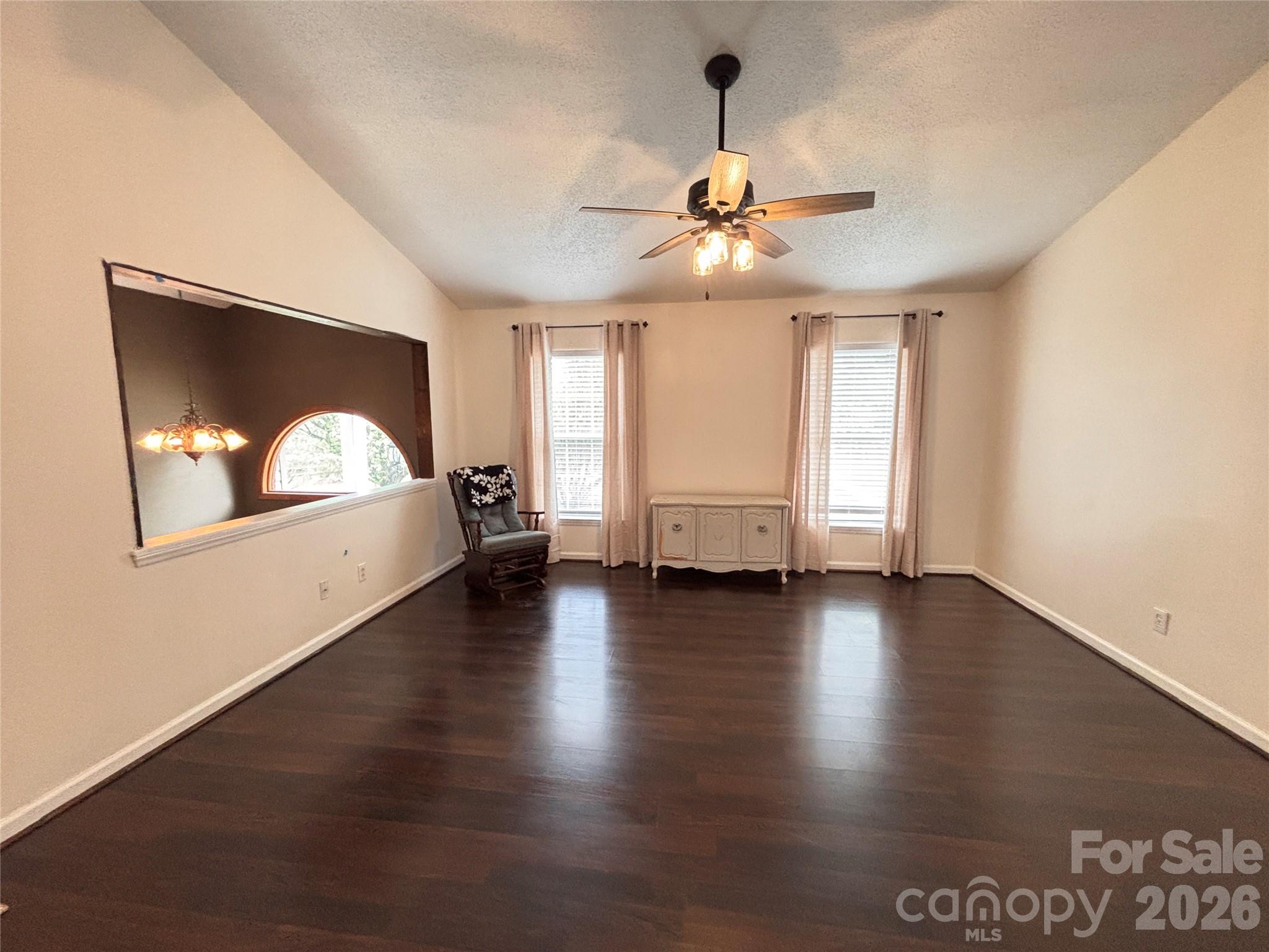 5164 Ralph Winchester Road Lenoir, NC 28645 - Photo 2 of 20 a view of an empty room with window and wooden floor