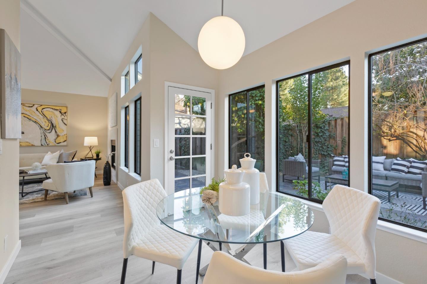 2080 Marich Way, Unit 15 Mountain View, CA 94040 - Photo 16 of 38 a view of a dining room with furniture wooden floor and a chandelier