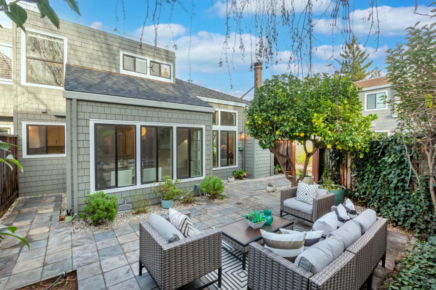 2080 Marich Way, Unit 15 Mountain View, CA 94040 - Photo 32 of 38 a view of a patio with couches table and chairs and potted plants