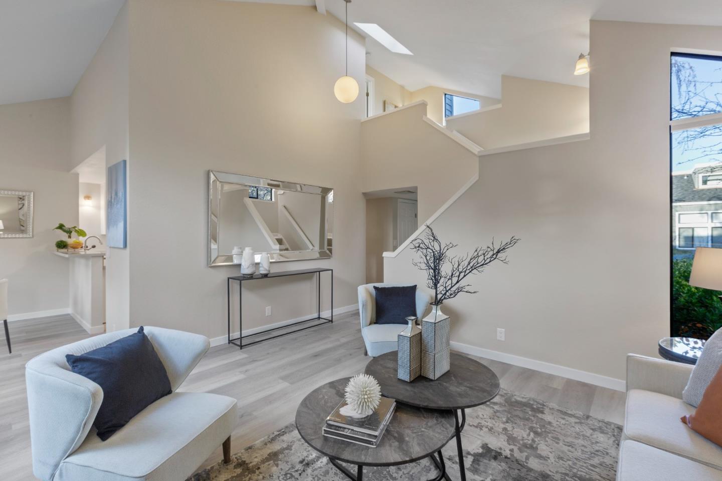 2080 Marich Way, Unit 15 Mountain View, CA 94040 - Photo 5 of 38 a living room with furniture and stairs