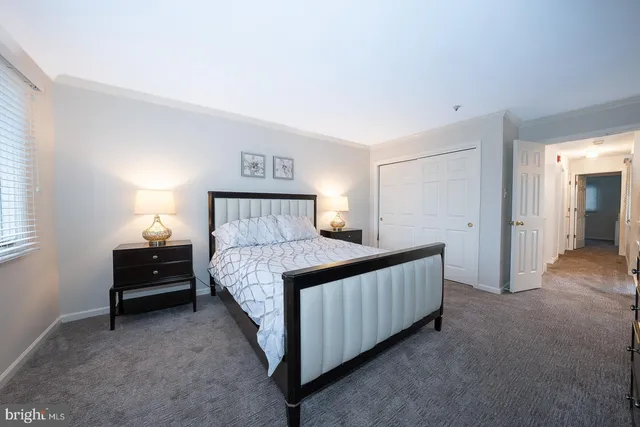a white bath tub sitting in a bathroom next to a bathroom sink