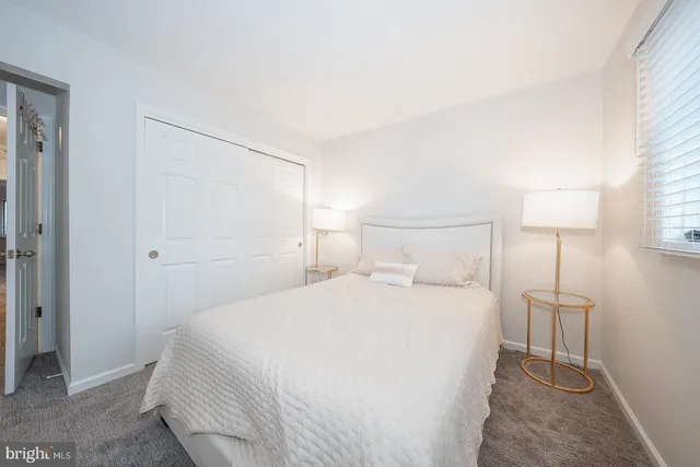 a view of a livingroom with furniture and a window