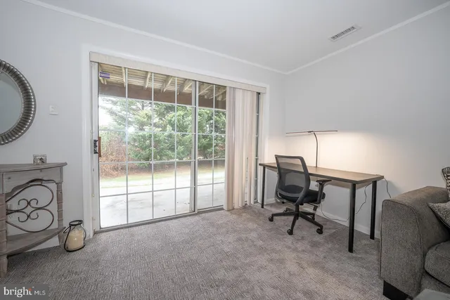 a bedroom with a bed and a night stand