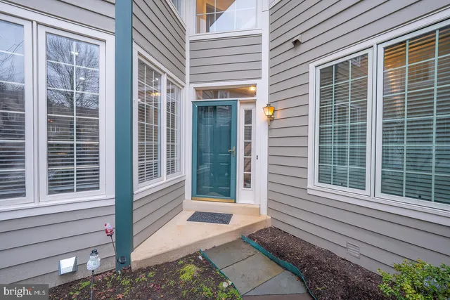 a view of a livingroom with wooden floor and stairs