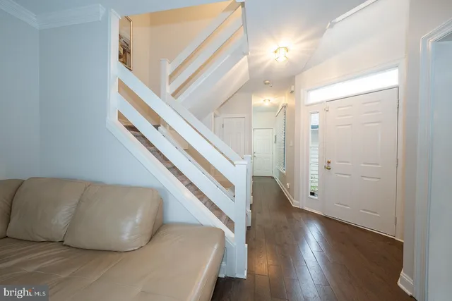 a living room with furniture fireplace and window