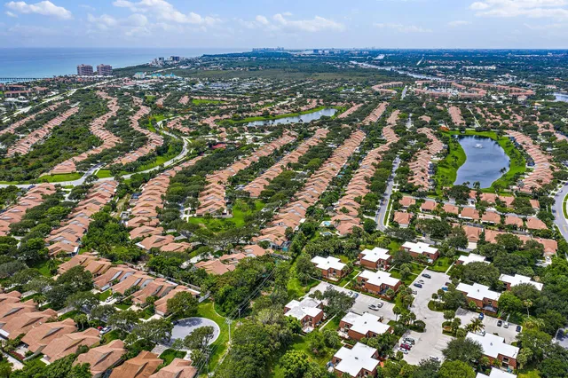 an aerial view of residential houses with city view