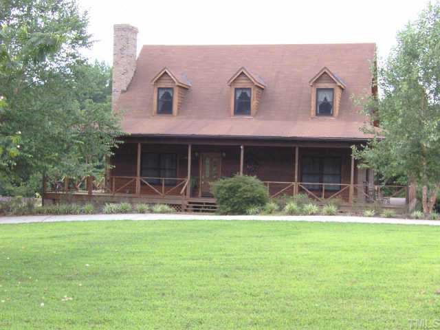 1445 Robertson Road Roxboro, NC 27574 - Photo 1 of 1 a front view of a house with a yard