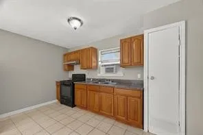 a kitchen with stainless steel appliances granite countertop a sink and cabinets