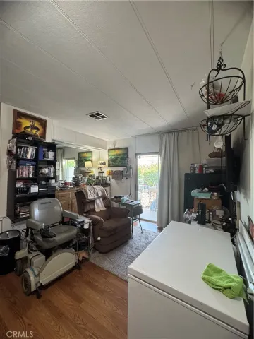 a bedroom with furniture window and a flat screen tv