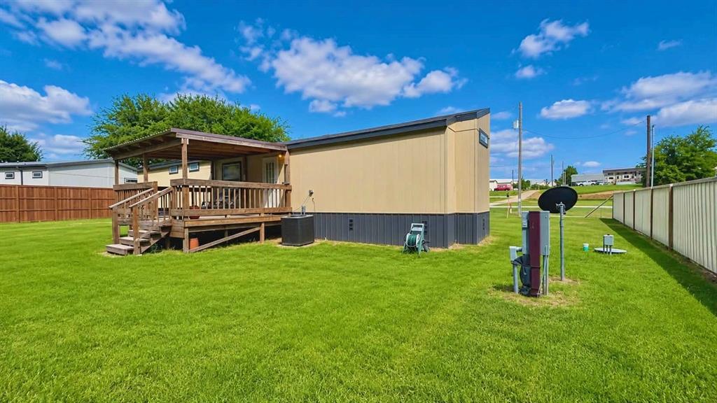 741 Waterfront Row Quitman, TX 75783 - Photo 27 of 40 a front view of a house with garden
