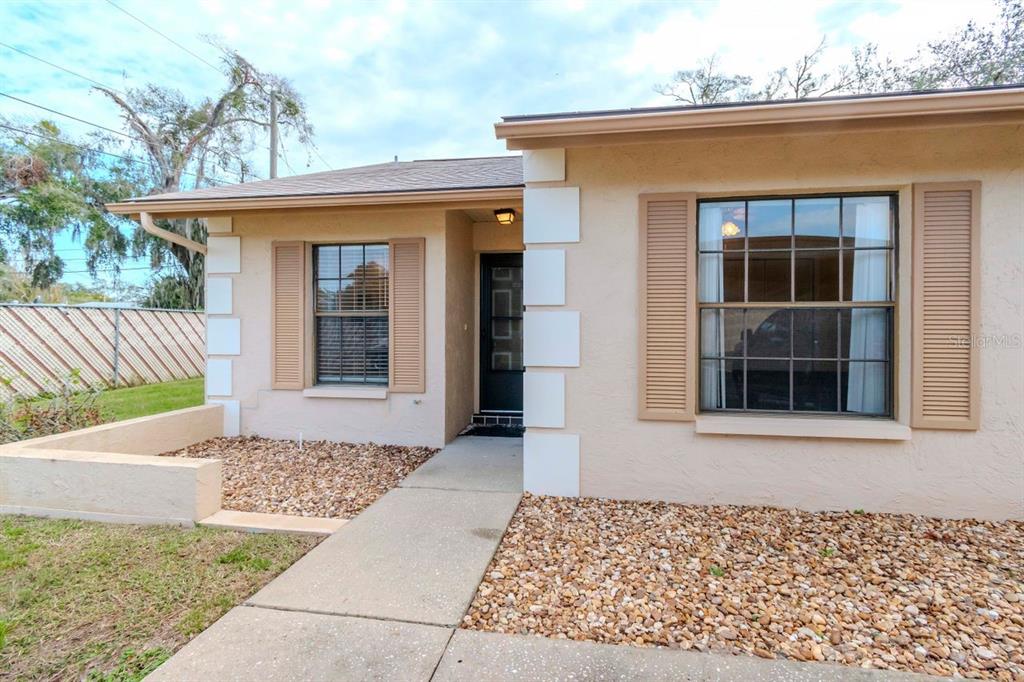 1852 Rising Sun Drive Holiday, FL 34690 - Photo 1 of 1 Front door of unit and side yard
