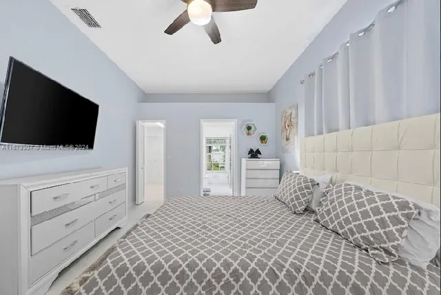 a bedroom with a bed and a cabinets