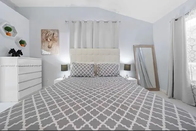 a living room with a couch and a flat screen tv