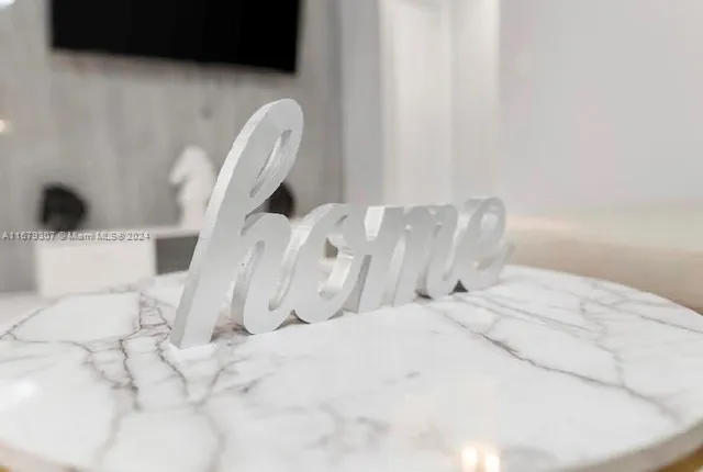 a bedroom with bed and a window