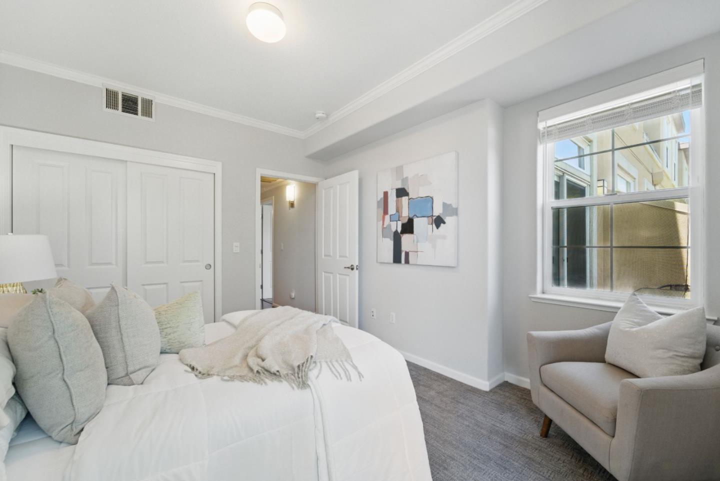 1388 Broadway, Unit 328 Millbrae, CA 94030 - Photo 13 of 25 a bedroom with a bed and a couch