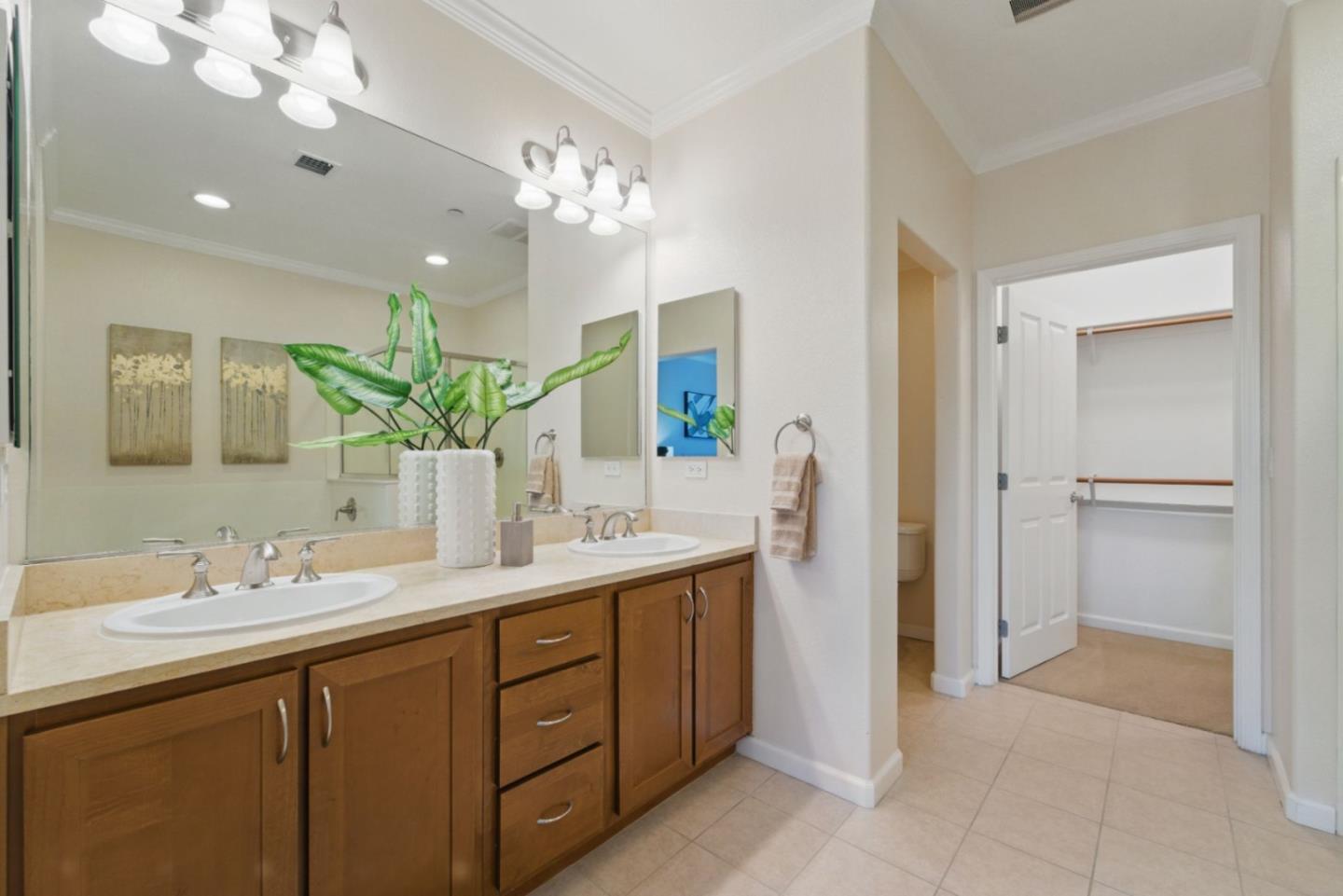 1388 Broadway, Unit 328 Millbrae, CA 94030 - Photo 15 of 25 a spacious bathroom with a double vanity sink and a mirror