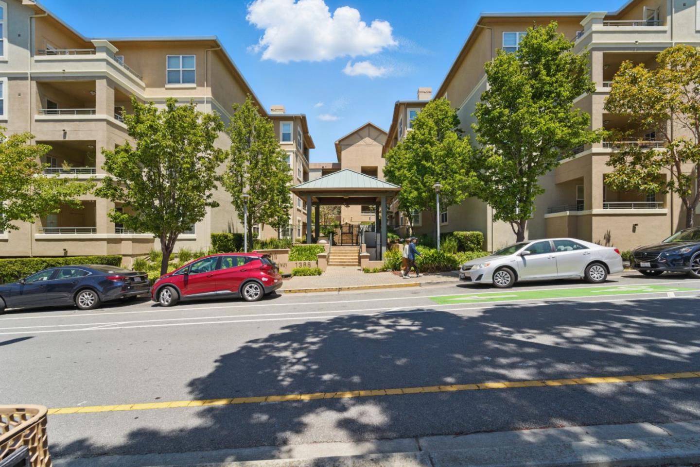1388 Broadway, Unit 328 Millbrae, CA 94030 - Photo 25 of 25 a front view of a house with a yard and parking