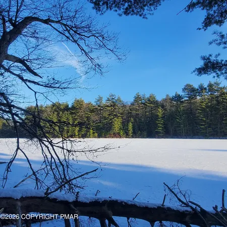 a backyard of a house with yard and outdoor seating