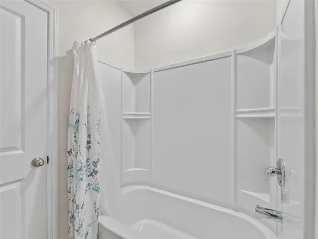 a living room with a couch and a window