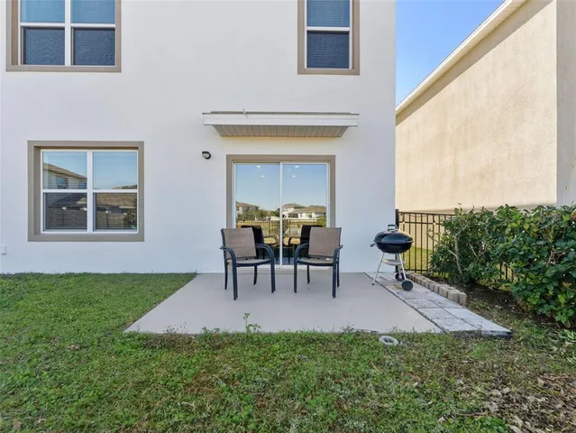 an aerial view of a house with a lake view