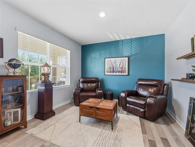 a living room with furniture and a window