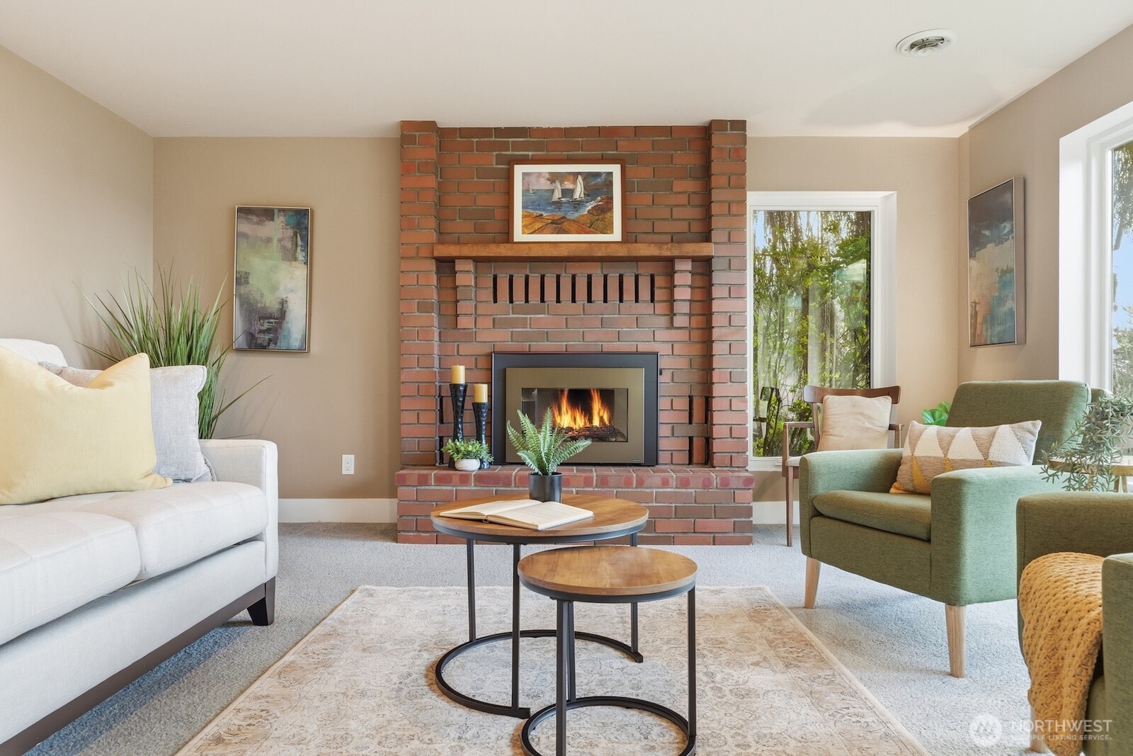 5311 Sound Avenue Everett, WA 98203 - Photo 26 of 40 a living room with furniture a table and a fireplace