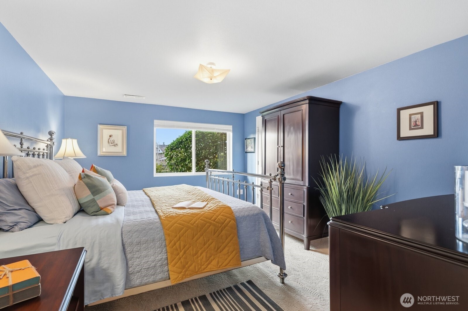 5311 Sound Avenue Everett, WA 98203 - Photo 28 of 40 a bedroom with a large bed and a window