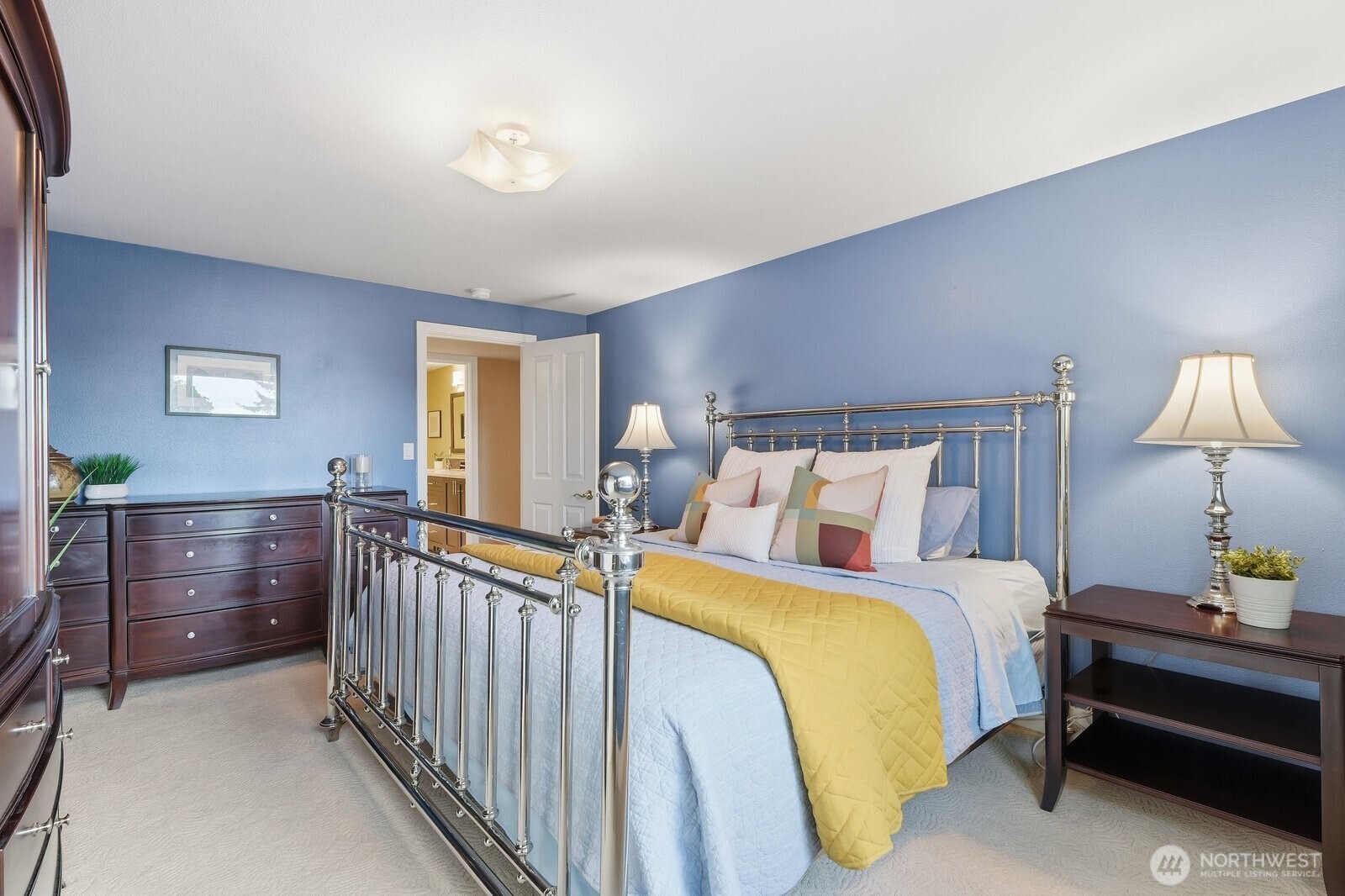 5311 Sound Avenue Everett, WA 98203 - Photo 29 of 40 a bedroom with a bed and a lamp on dresser
