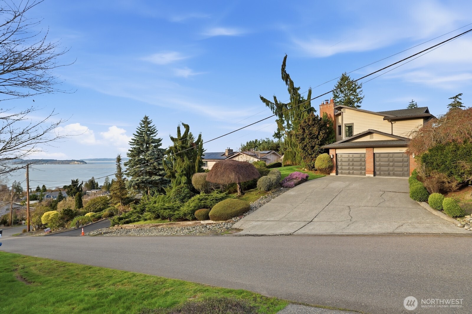 5311 Sound Avenue Everett, WA 98203 - Photo 31 of 40 a front view of a house with a yard and street
