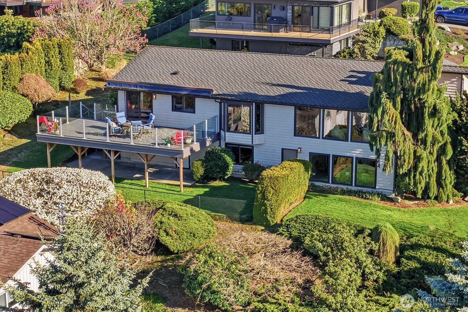 5311 Sound Avenue Everett, WA 98203 - Photo 34 of 40 a front view of a house with garden and sitting area