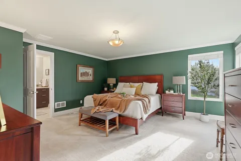 a living room with lots of furniture and view of kitchen