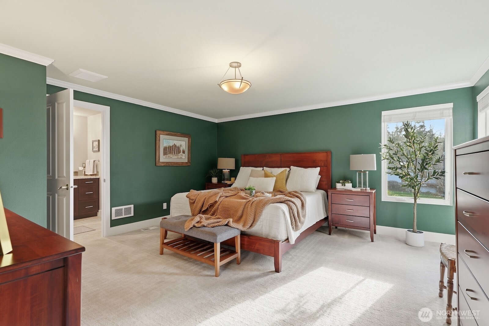 5311 Sound Avenue Everett, WA 98203 - Photo 7 of 40 a bedroom with a bed and a chandelier