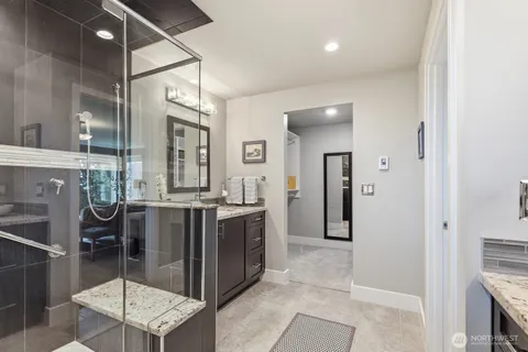 a bedroom with two bed and a desk