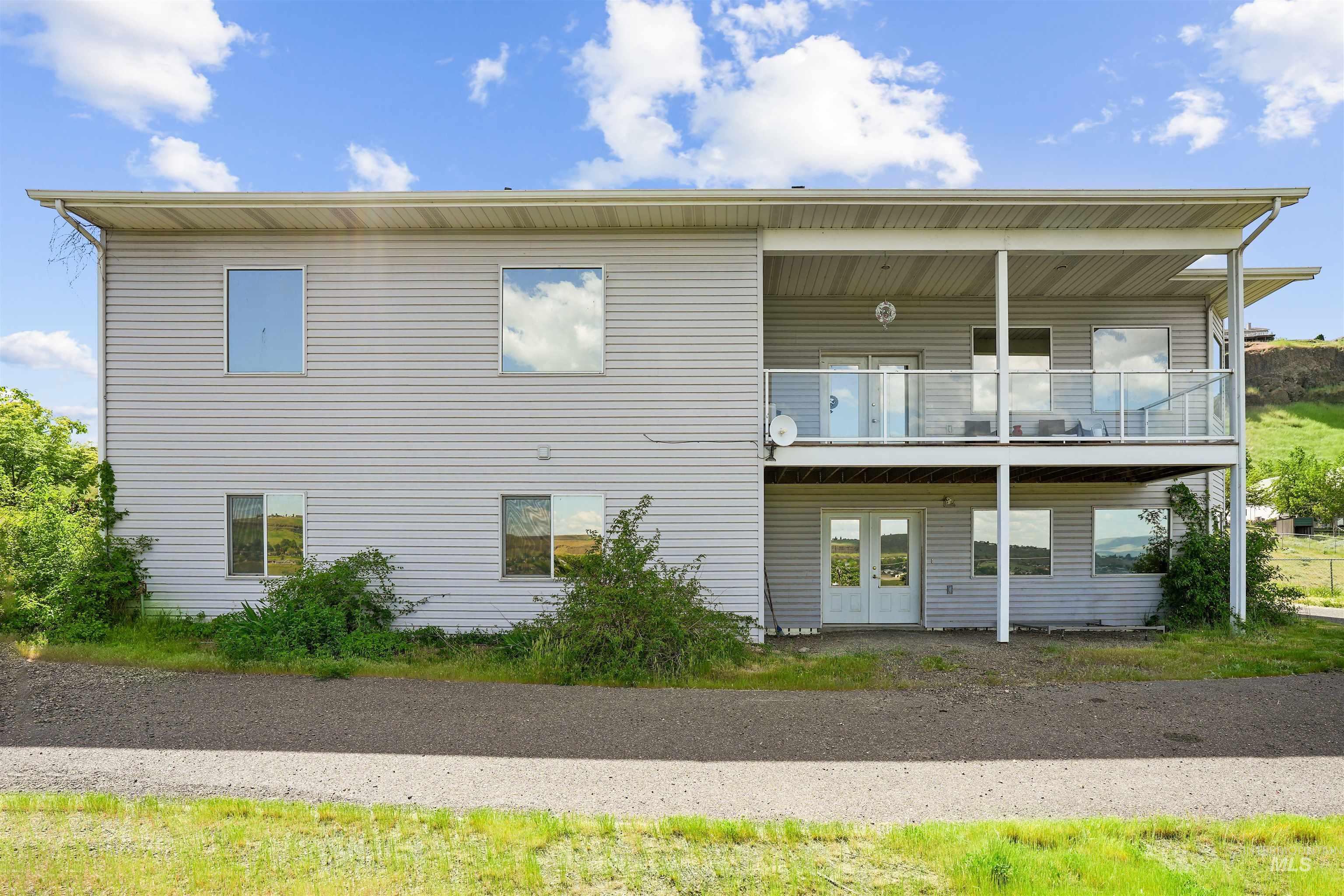 2750 South Perry Lane Clarkston, WA 99403 - Photo 4 of 47 Two-story exterior with horizontal siding and multiple windows