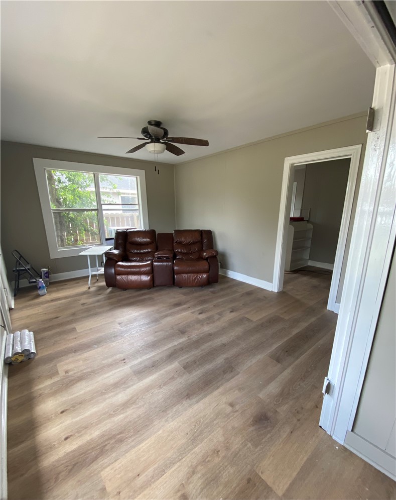 408 East 4th Street Alice, TX 78332 - Photo 6 of 14 a living room with furniture and a window