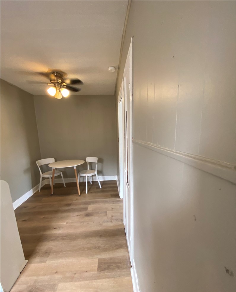 408 East 4th Street Alice, TX 78332 - Photo 7 of 14 a dining room with furniture and a chandelier
