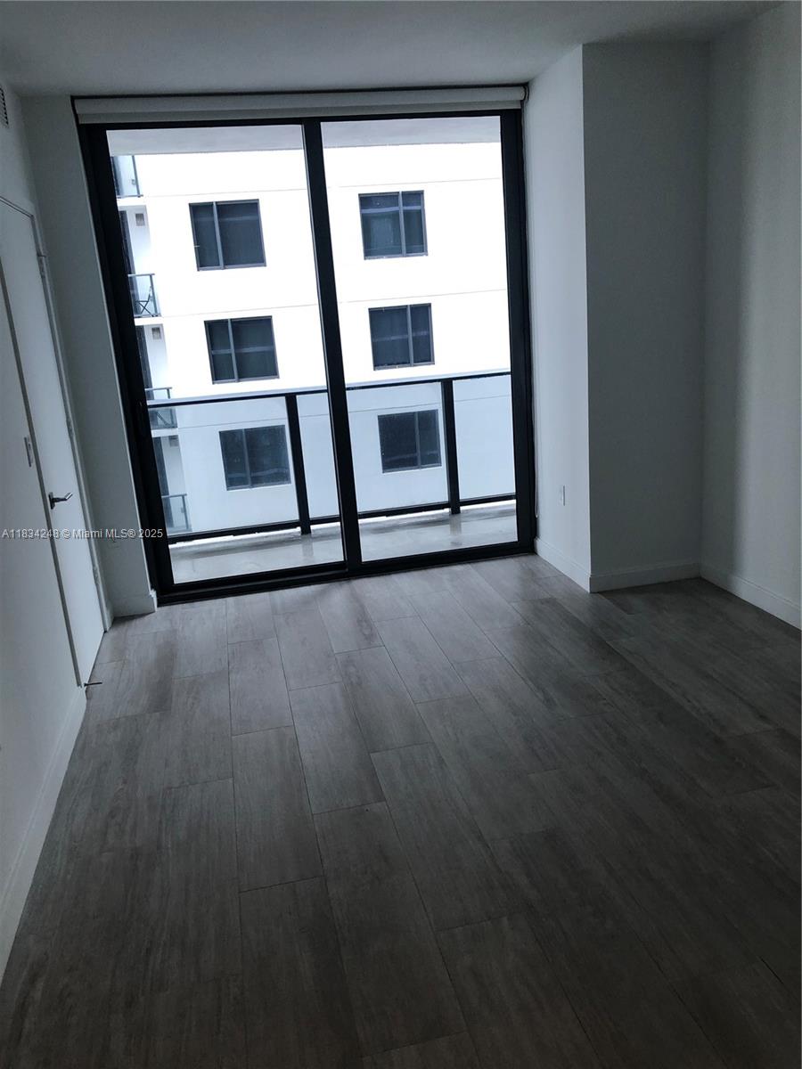 55 Southwest 9th Street, Unit 3009 Miami, FL 33130 - Photo 11 of 15 a view of an empty room with a window