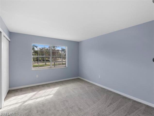 4900 Biscayne Drive, Unit 23 Naples, FL 34112 - Photo 13 of 21 View of carpeted spare room