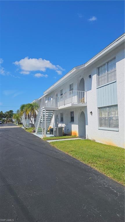 4900 Biscayne Drive, Unit 23 Naples, FL 34112 - Photo 19 of 21 View of property with cooling unit