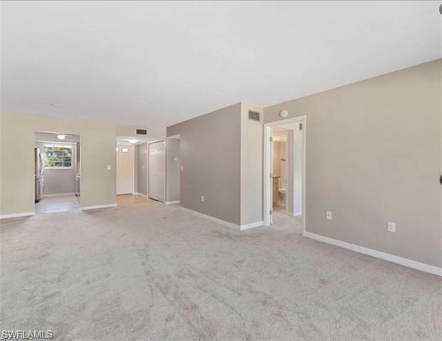 4900 Biscayne Drive, Unit 23 Naples, FL 34112 - Photo 7 of 21 View of carpeted spare room