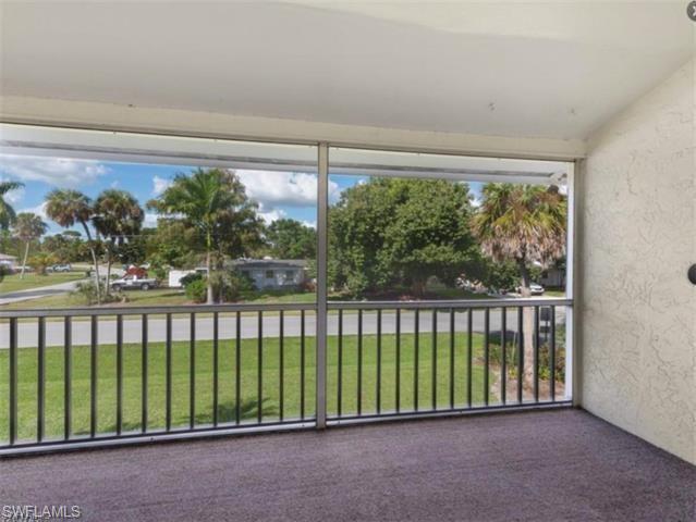 4900 Biscayne Drive, Unit 23 Naples, FL 34112 - Photo 9 of 21 Unfurnished sunroom featuring a wealth of natural light