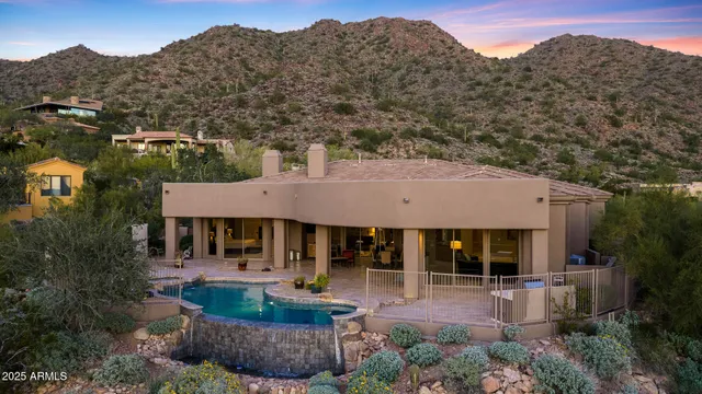 a view of a house with a backyard and a garden