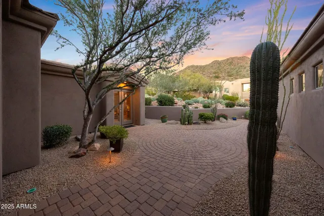 a view of backyard with a table and a chairs