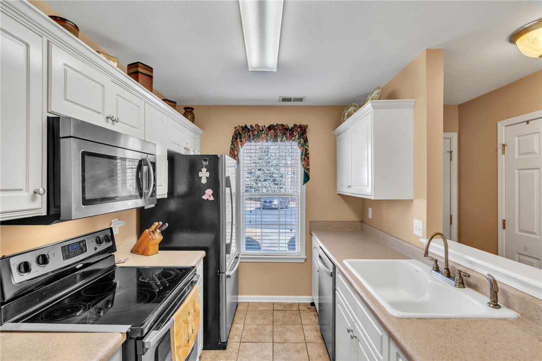 18 Sweetgrass Trail Anderson, SC 29625 - Photo 10 of 26 This functional kitchen features ample cabinet space and modern appliances, ready for culinary creativity.