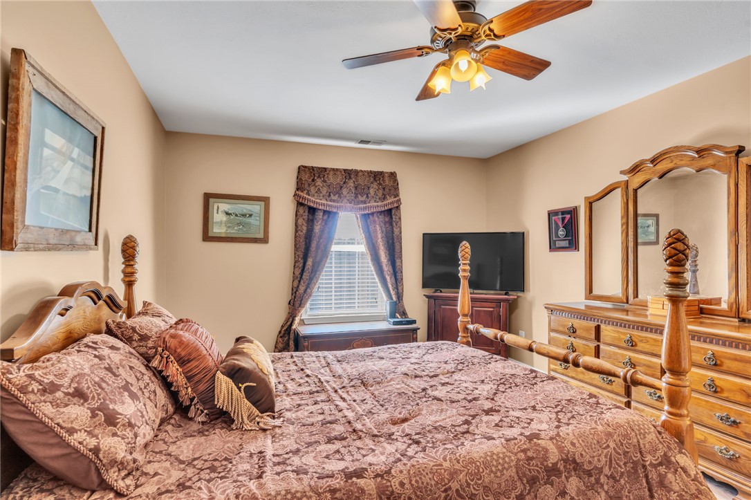 18 Sweetgrass Trail Anderson, SC 29625 - Photo 14 of 26 This cozy bedroom features a ceiling fan, providing comfort and a touch of traditional charm.