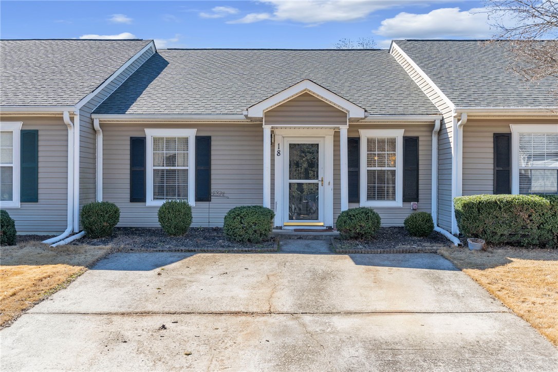 18 Sweetgrass Trail Anderson, SC 29625 - Photo 2 of 26 This charming home offers a simple facade with inviting curb appeal and a functional driveway.