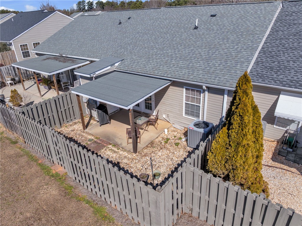18 Sweetgrass Trail Anderson, SC 29625 - Photo 21 of 26 This private fenced backyard features a covered patio, perfect for relaxation and outdoor entertaining.