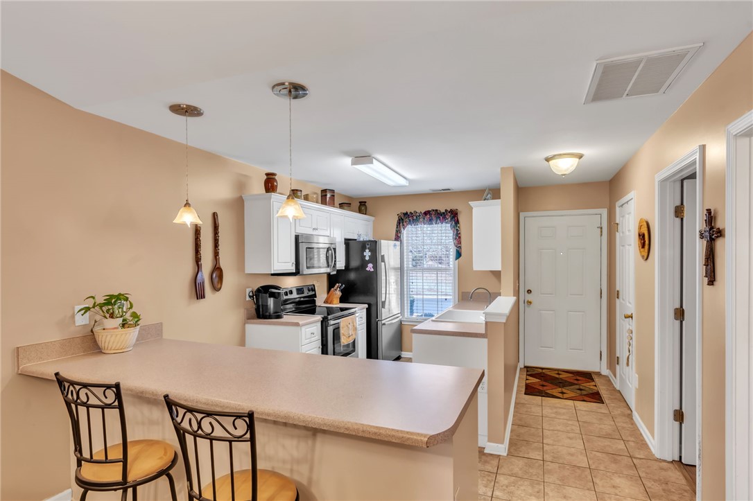 18 Sweetgrass Trail Anderson, SC 29625 - Photo 8 of 26 Bright and open, this kitchen offers ample counter space and a convenient breakfast bar.