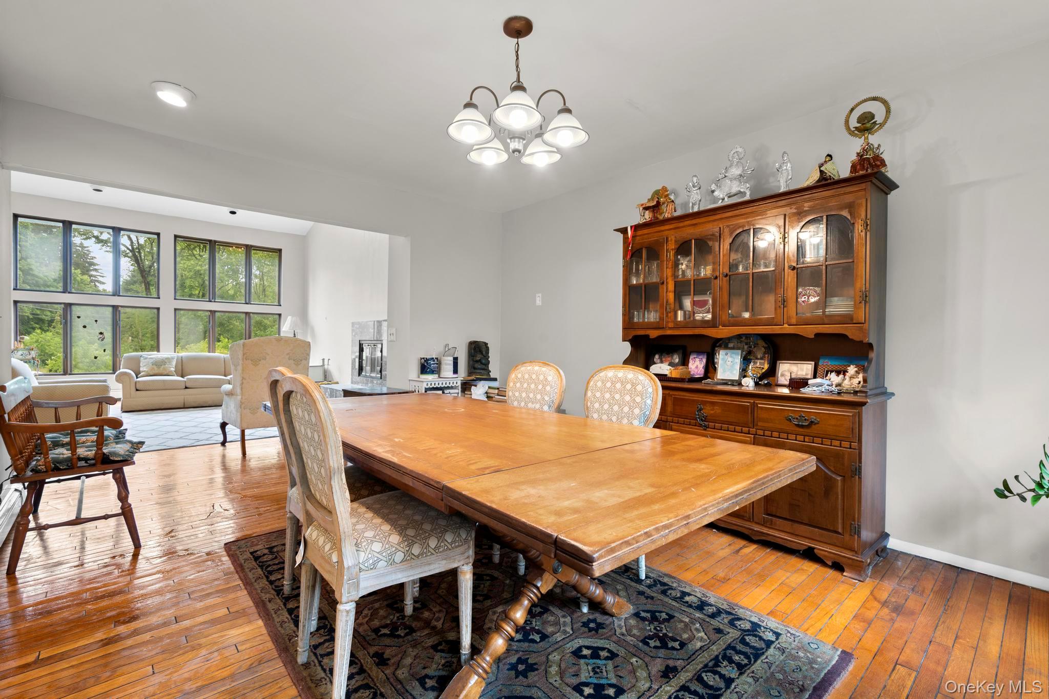 513 Bedford Road Armonk, NY 10504 - Photo 11 of 38 a view of a dining room with furniture and wooden floor